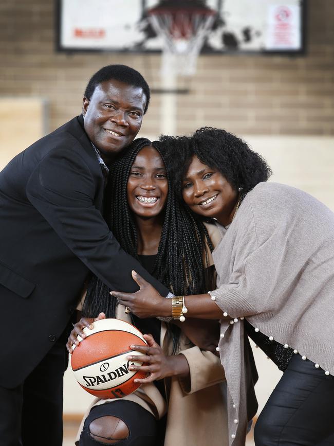 Basketballer Ezi Magbegor with her proud parents Appolus and Patience after her selection in the WNBA draft to Seattle Storm. Picture: David Caird