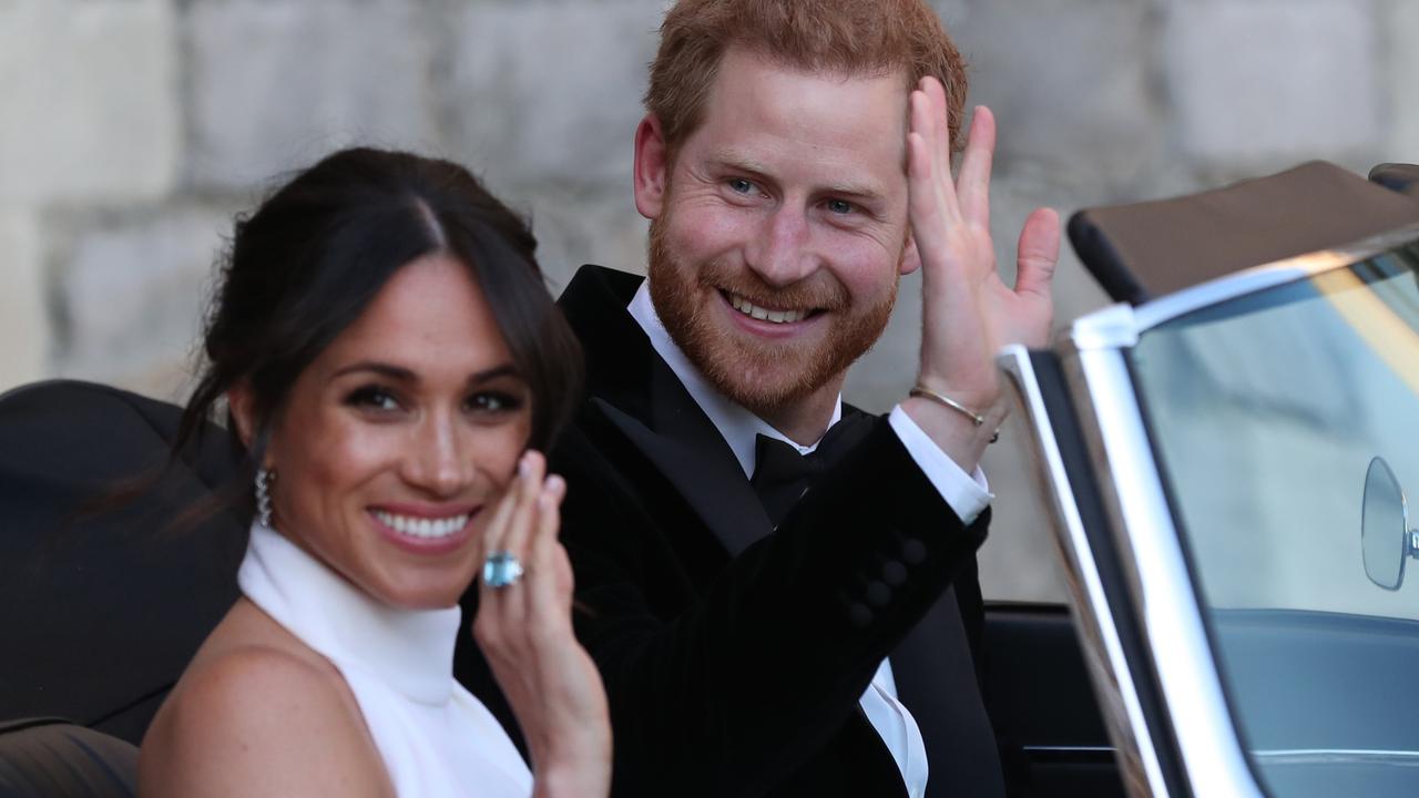 Meghan Markle and Prince Harry basking in the adoration of A-list celebs on their wedding day. Picture: Steve Parsons Getty