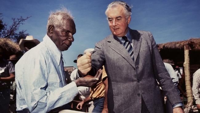 Gough Whitlam pours soil into the hands of Vincent Lingiari, Northern Territory in 1975