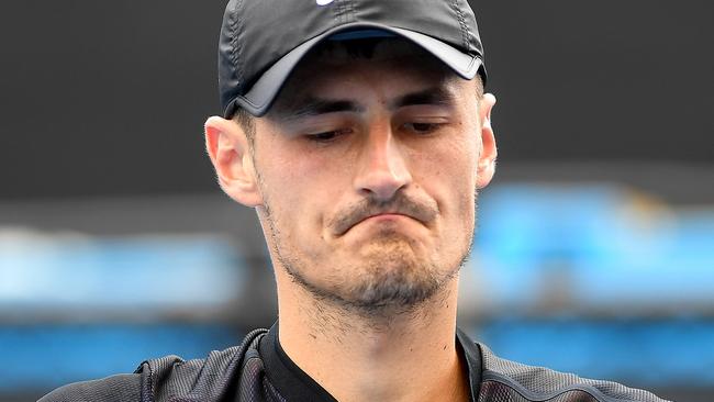 Bernard Tomic reacts during his three-set defeat to Lorenzo Sonego in qualifying. Picture: AAP