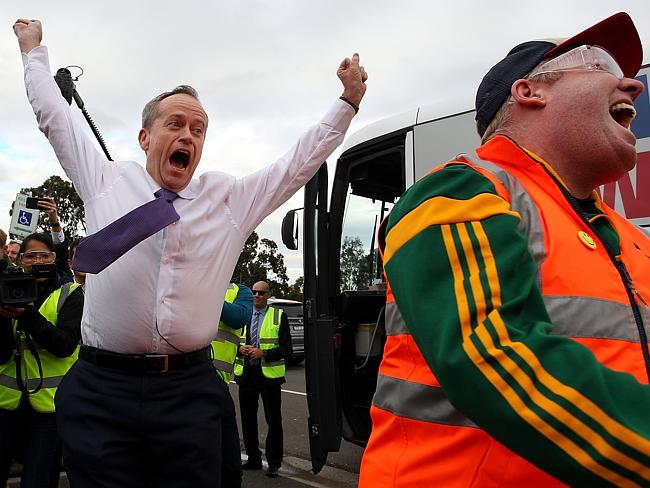 Bill Shorten is elated after defeating reporter Peter Helliar in a ‘Hi-Vis’ competition on arrival to Bombardier Transportation Manufacturing on June 21, 2016 in Dandenong, Australia. Picture: Lisa Maree Williams/Getty Images