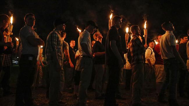 Multiple white nationalist groups march with torches through the University of Virginia campus in Charlottesville. Picture: Mykal McEldowney/The Indianapolis Star via AP