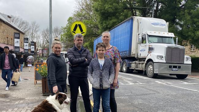 Hahndorf locals Catherine McLeod, with her dog Hunter, Jeremy Roberts, Cathryn Nitschke and son Solomon Nitschke in the Main Street. Picture: Dylan Hogarth