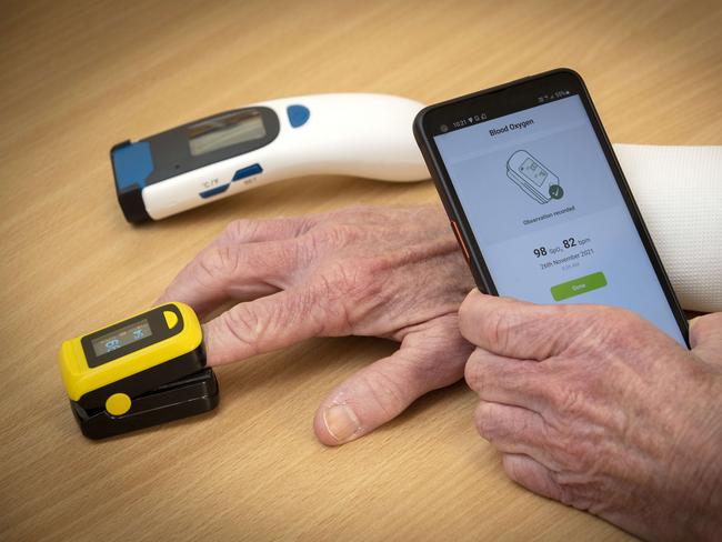 The Covid home care kit contains a mobile phone with MyCareManager app installed, a digital thermometer and an oximeter. Picture: Chris Kidd