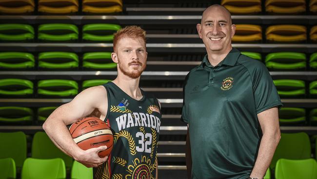 Woodville coach Scott Whitmore (right) with player James Boonstoppel. Whitmore believed a new approach had put his side in strong position to attack the second half of the season. Picture: Roy VanDerVegt