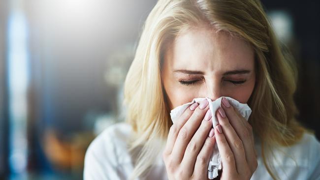 The flu virus is carried in tiny droplets from coughs and sneezes.