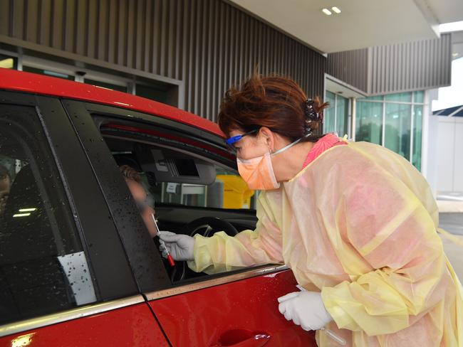 Dr Sandra Peters tests a person for coronavirus at a fever clinic in Caloundra. Picture: John McCutcheon