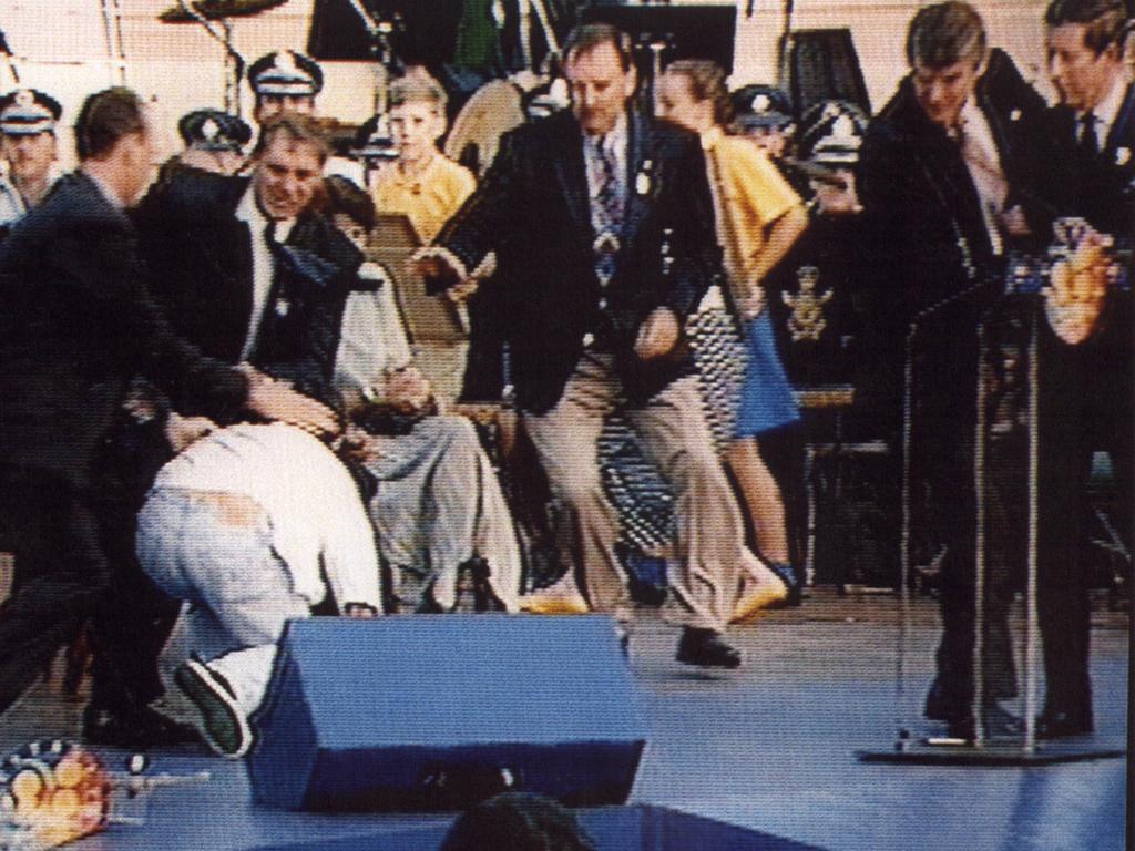 Charles (far right) looks on as David Kang, a 23-year-old university student who fired a starting pistol at the prince, is taken down by security. Picture: Supplied