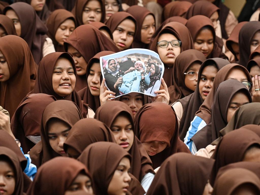 Islamic junior high school students take part in a Quran recitation and make special prayers for the victims of the earthquake in Morocco and the flash flood in Libya, in Banda Aceh, Indonesia. Picture: Chaideer Mahyuddin/AFP