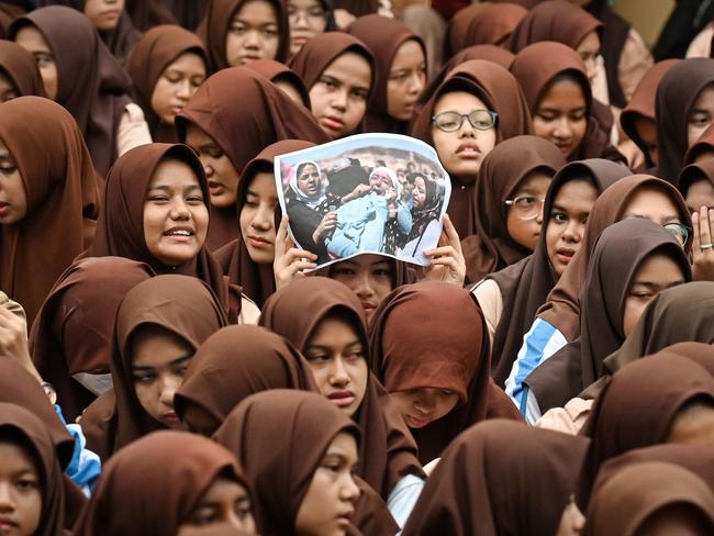 Islamic junior high school students take part in a Quran recitation and make special prayers for the victims of the earthquake in Morocco and the flash flood in Libya, in Banda Aceh, Indonesia. Picture: Chaideer Mahyuddin/AFP 