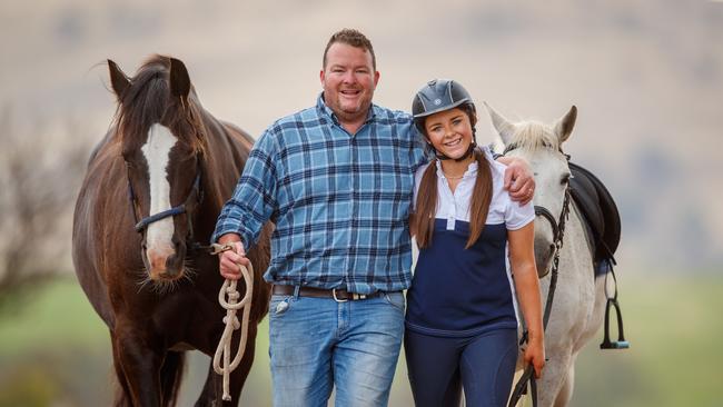 Andrew ‘Cosi’ Costello with his daughter Matilda and horses Molly and Winnie, on his farm at Harrogate. Picture Matt Turner