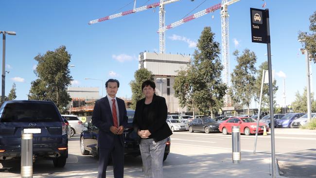 Macquarie Fields Labor MP Anoulack Chanthivong and Werriwa Labor MP Anne Stanley at Edmondson Park railway station.