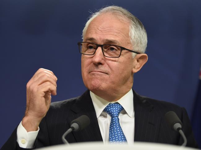 Prime Minister Malcolm Turnbull along with Attorney General George Brandis address the media in Sydney, Monday, July 25, 2016. Mr Turnbull will work with the state and territory leaders to roll out a system of post-sentence preventative detention for terrorists who are at high risk of reoffending. (AAP Image/Dan Himbrechts) NO ARCHIVING