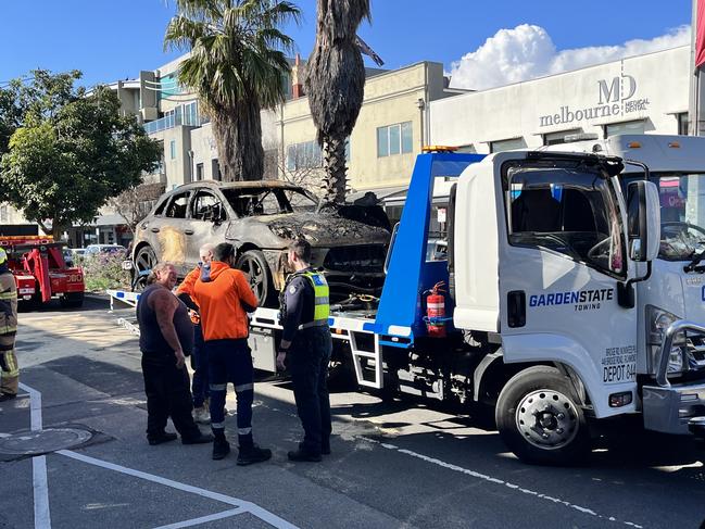 The burnt out Porsche after it was removed from the building.