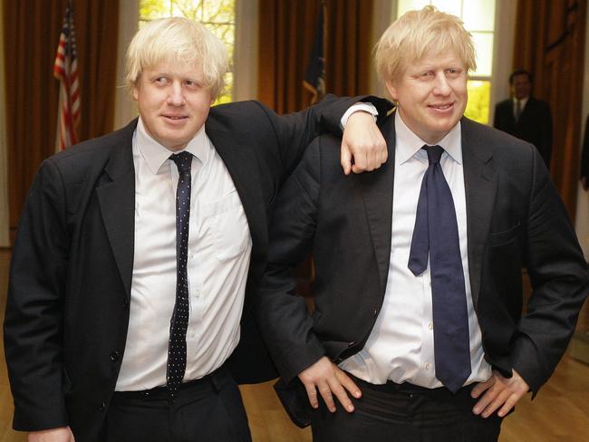 London Mayor Boris Johnson (L) poses with a wax figure of himself as it is unveiled at the Madame Tussauds waxwork museum in London, on May 5, 2009. AFP PHOTO/Shaun Curry