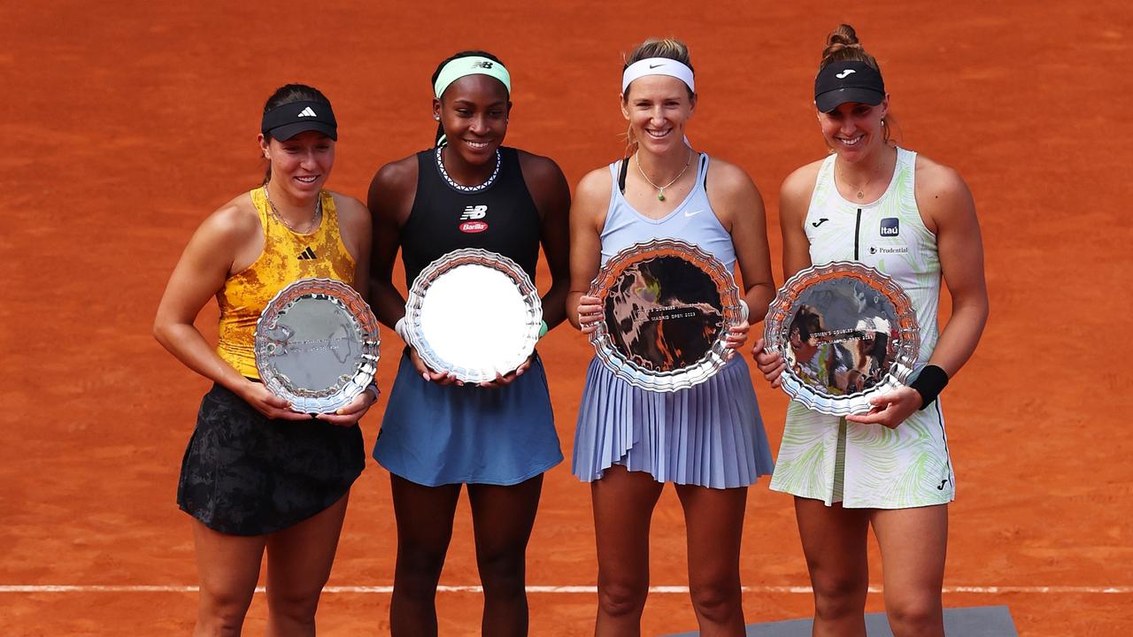 (L-R) Runners up Coco Gauff and Jessica Pegula of United States and Winners Victoria Azarenka and Beatriz Haddad Maia of Brazil pose while holding their trophies. (Photo by Julian Finney/Getty Images)