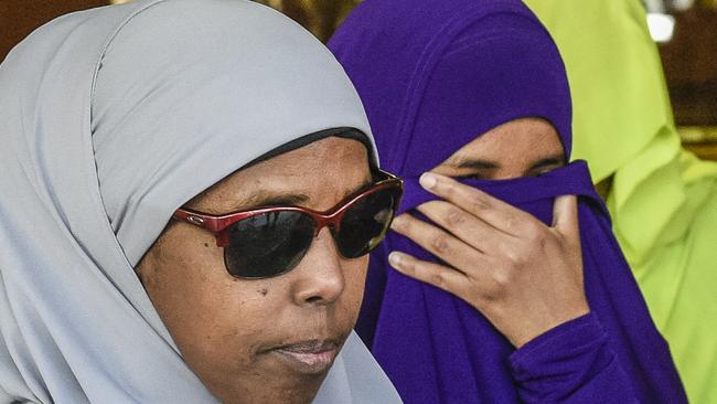 Zainab Abdirahman Khalif (centre) leaves the Supreme Court in Adelaide in October 2019 after her conviction for terrorism offences was overturned.