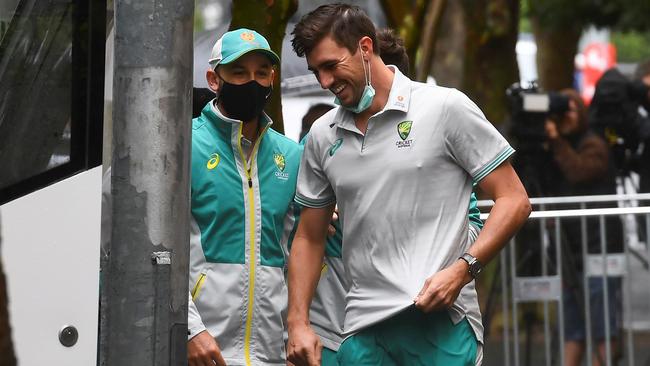 Australian bowlers Nathan Lyon, left, and Pat Cummins in Melbourne on Monday. Picture: William West/AFP)