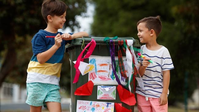 Spreading messages of love are Campbell, 9, and his brother Parker, 6 Picture Matt Turner