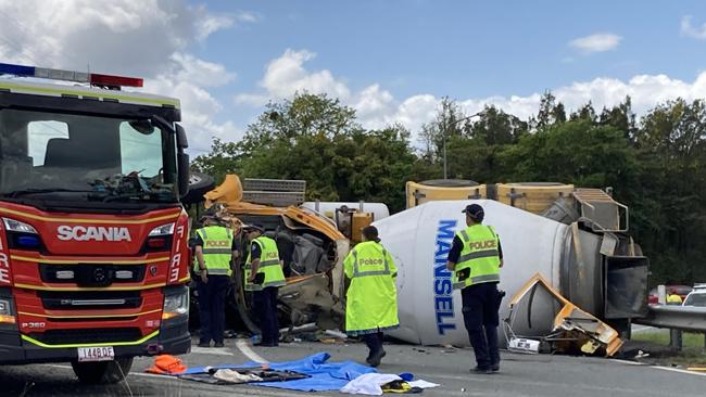 Emergency crews at the scene of a cement truck rollover at just off the Bruce Hwy, at Gympie, Friday September 29, 2023.