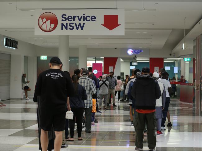 Lengthy — but socially distant — queues outside a Service NSW shop in Bankstown. Picture: Britta Campion