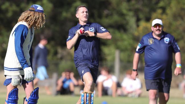 Barwon Heads FC vs Barwon Heads CC cricket match. Joel Selwood playing for the football team and Fox Sports commentator Mark Howard playing for the cricket team.Cricketers batting and footballers bowling.Joel Selwood bowling Picture: Mark Wilson