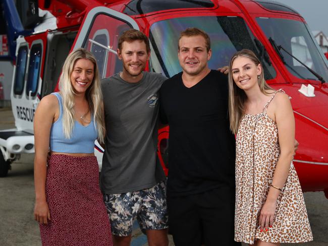 Craig Simpson is lucky to be alive after falling from Emerald Creek Falls on March 6 this year, suffering a fractured spine, broken ribs and life threatening head injuries. His friends kept Craig alive until the QGAir rescue helicopter arrived and saved his life. On Friday, Olivia McDonald, Dylan Lazzaroni, Craig Simpson and Ashlie Majewski got to thank the rescue aircrew that saved Craig's life at the QGAir hangar at Cairns Airport. Picture: Brendan Radke