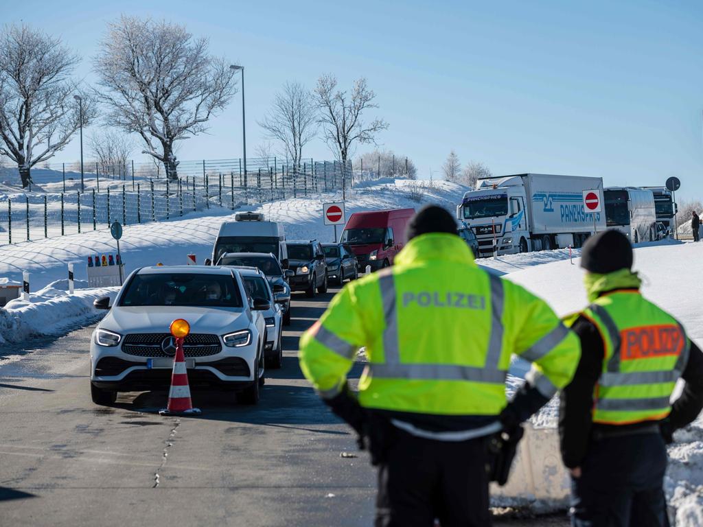 Officers of the Federal Police control car drivers at the German-Czech border as Germany implements more Covid measures. Picture: AFP