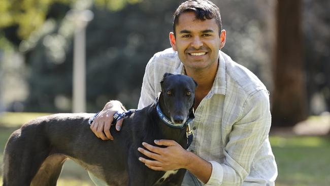 Ash D'Souza says his fostered greyhound Willa has made him happy. Picture: Tim Hunter