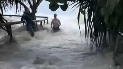 ‘Holy s***’: Beach car park inundated by huge tidal surge