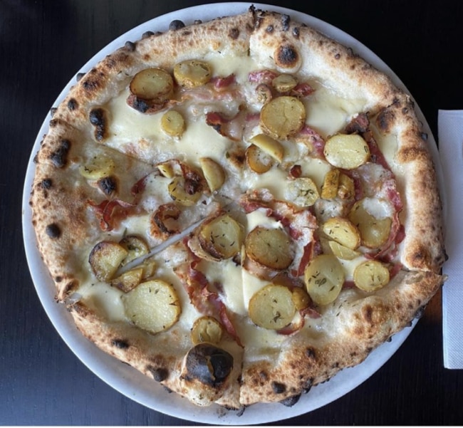 A favourite from the new menu at Beccofino is the Patate pizza: mozzarella, kipfler potatoes, pancetta, rosemary and provolone. Picture: Instagram @beccofinoteneriffe