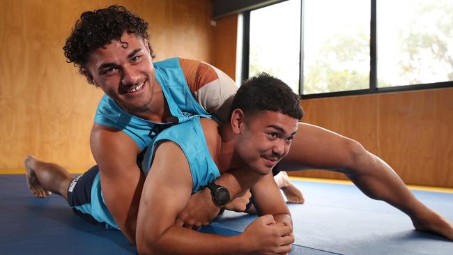 Jojo Fifita gets the upper hand in a wrestle with Kaleb Ngamanu. Picture Glenn Hampson.