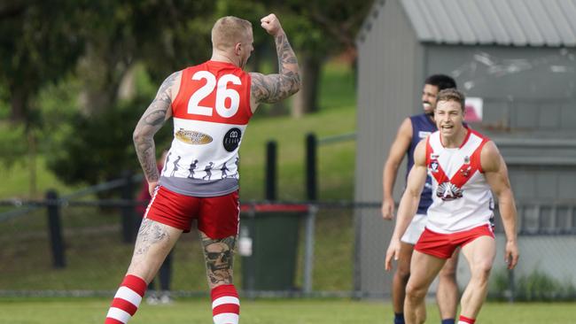 Riley D’Arcy celebrates a goal for Karingal. Picture: Valeriu Campan