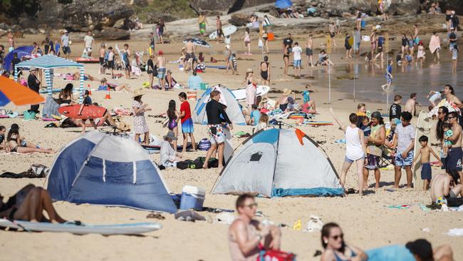 Beachgoers at the northern beaches on Sunday. Picture: Tim Pascoe