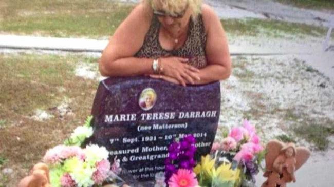 Charli Darragh at the grave site of her mother, Marie Darragh.