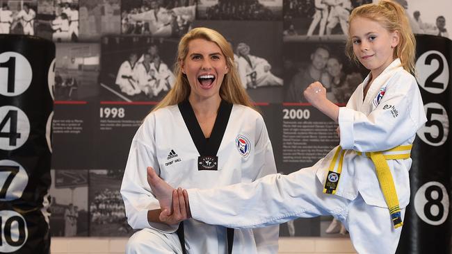 Personal trainer Tiffiny Hall, with student Isabelle Gray,  became a taekwondo instructor at the age of 16. Picture: David Smith
