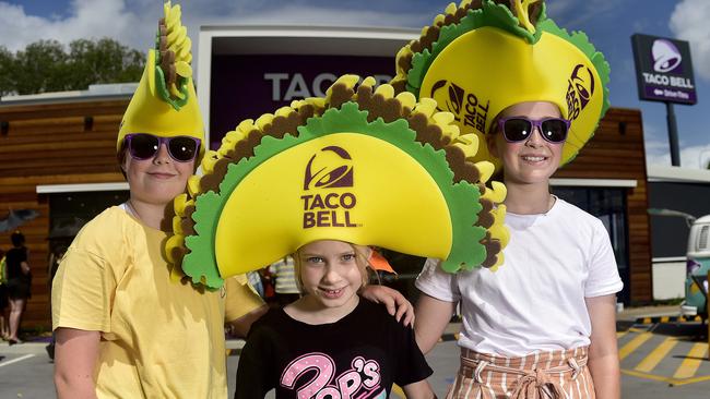 Taco Bell in Townsville officially opened in November 2019, attracting a long line of people and cars to the new restaurant. Luella Bright, 10, Poppi Bright, 8, and Mikayla Moore, 10, waiting in line. Picture: Matt Taylor