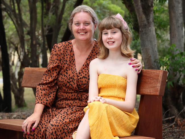 Montannah Creaser, 11, with her mother Roslyn Perry. Picture: Liam Kidston