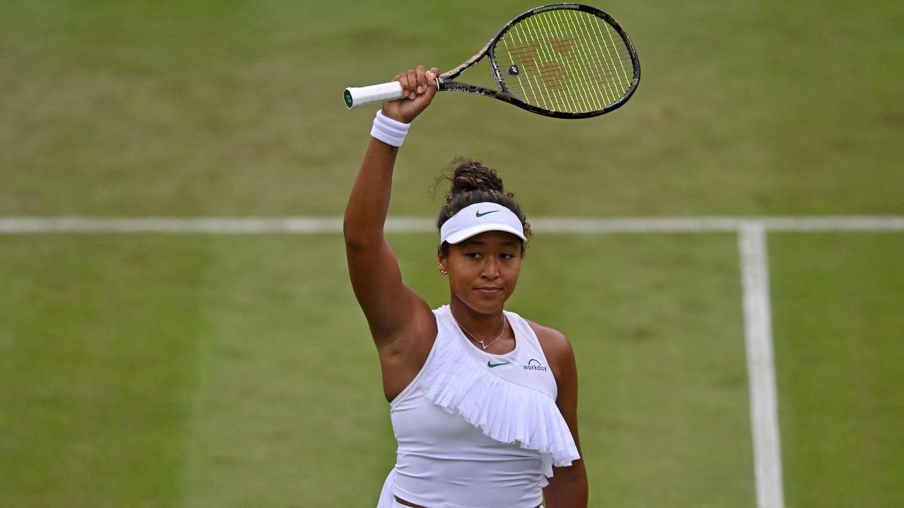 Japan's Naomi Osaka celebrates winning against France's Diane Parry during their Women's singles tennis match on the first day of the 2024 Wimbledon Championships at The All England Lawn Tennis and Croquet Club in Wimbledon, southwest London, on July 1, 2024. Osaka won the match 6-1, 1-6, 6-4. (Photo by ANDREJ ISAKOVIC / AFP)