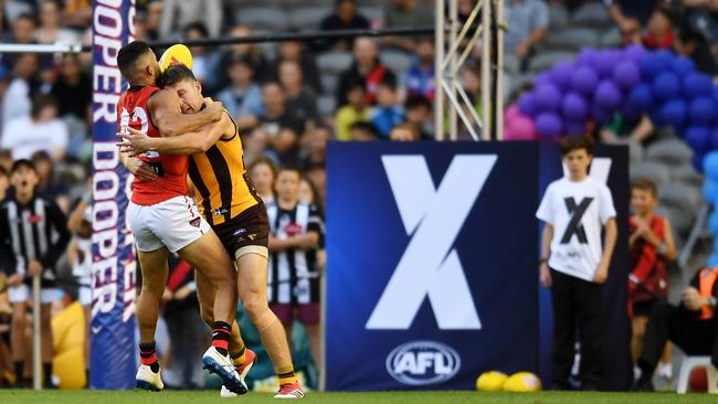 Anthony McDonald-Tipungwuti is tackled by Dallas Willsmore during an AFLX game at Etihad Stadium. Picture: AAP