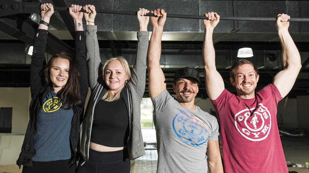 The Gold's Gym Toowoomba team (from left) Makayla Ings, Sammy Sorbara, Joe Sorbara and Bevin Jones hang from a beam in the former Aldi Clifford Gardens that they are converting into a Gold's Gym. Picture: Kevin Farmer