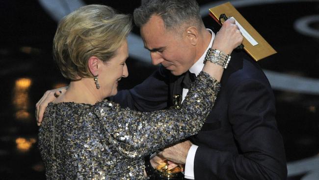 Meryl Streep presents the award for best actor in a leading role to Daniel Day-Lewis for Lincoln during the 2013 Oscars.