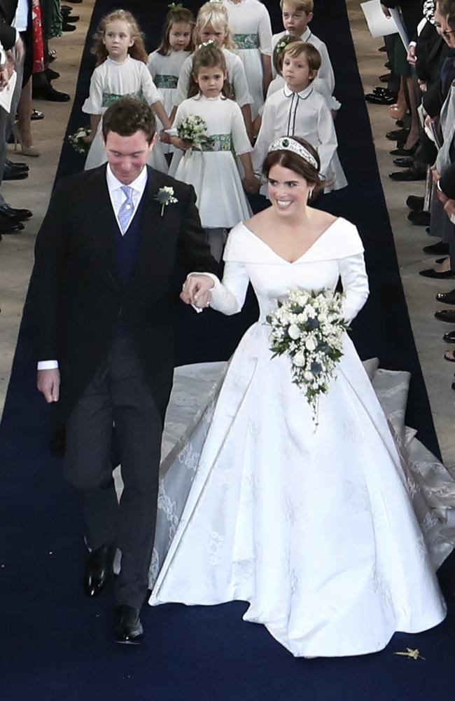 Princess Eugenie and Jack Brooksbank walk down the aisle following their marriage in St George’s Chapel, Windsor Castle, near London, England, Friday Oct. 12, 2018. (Danny Lawson/Pool via AP)