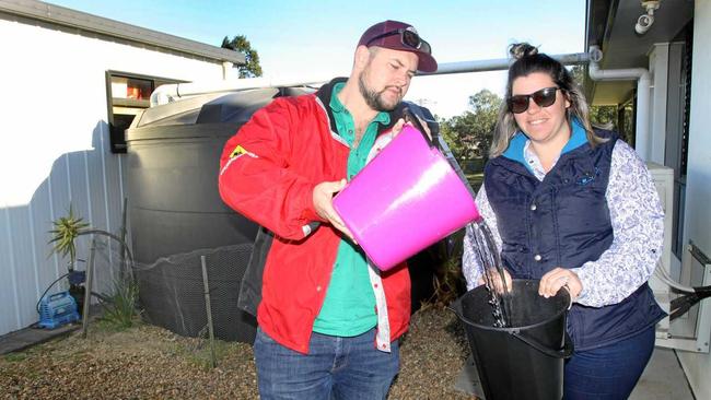 EASING THE LOAD: Jack and Amy Conroy from Woodford are offering up their full water tank to a farmer in need in Stanthorpe. Picture: Contributed