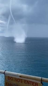 Three epic water sprouts appear out at sea