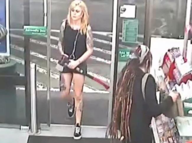 Amati enters the 7-Eleven in Enmore carrying an axe.