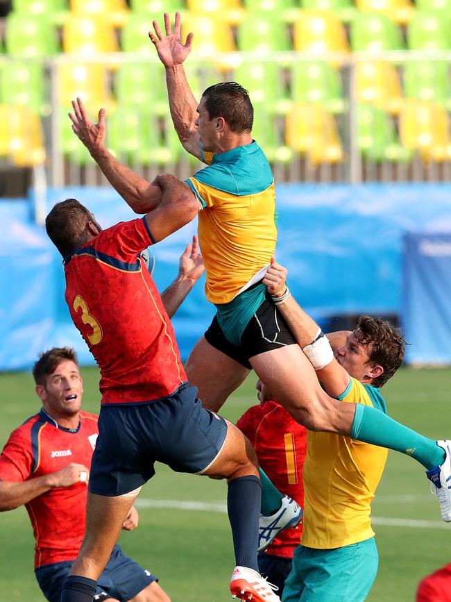 Ed Jenkins has the ball stripped during the 2016 Rio Olympic Men's Rugby Sevens game between Australia and Spain.