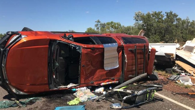 A strong gust of wind rolled over a car towing a caravan near Elliot. Picture: NTPFES