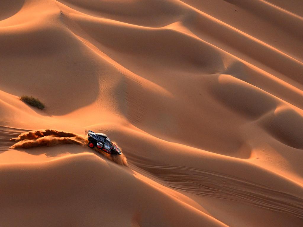 Team Audi Sport's driver Carlos Sainz and co-driver Lucas Cruz steer their car in the dunes between Shubaytah and Shubaytah as part of the Dakar Rally 2024. Picture: Patrick Hertzog/AFP