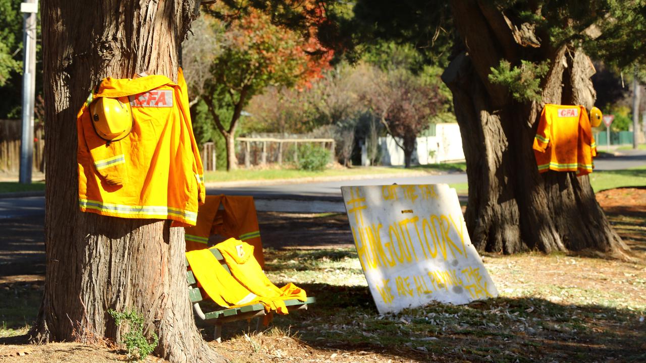 CFA volunteers have put signs and their uniforms in the main street of Inverleigh in protest of the fire services levy. Picture: Alison Wynd